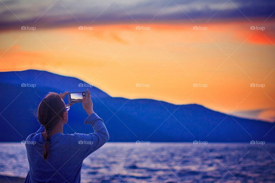 Woman looking on a sunset