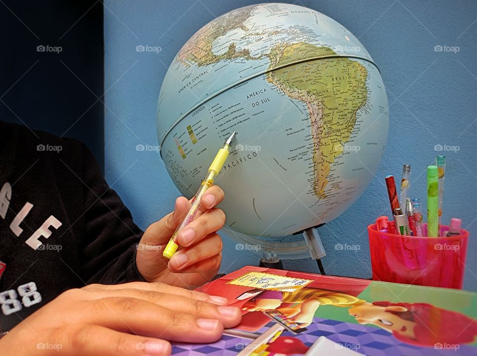 Student with world map globe