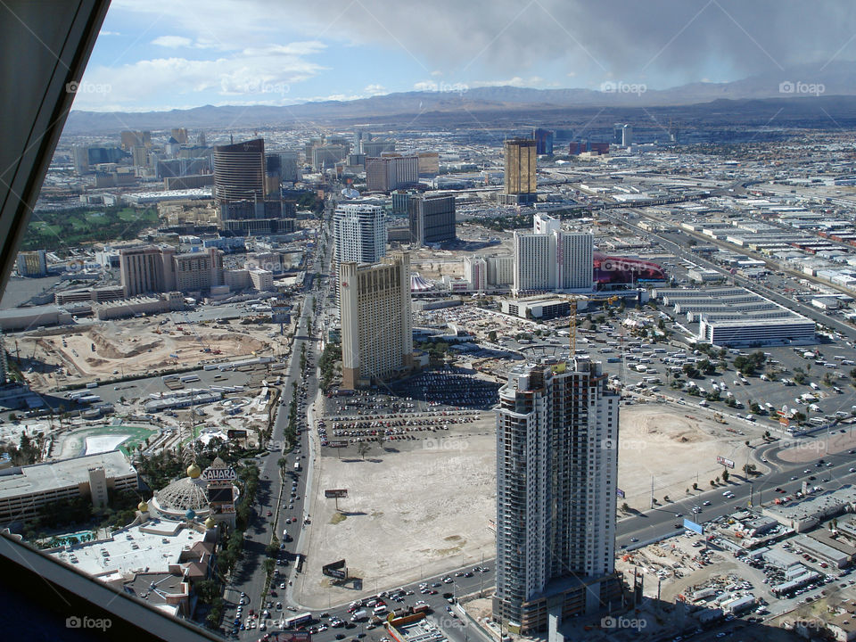 Top of the word - sky, mountains and a thriving city.