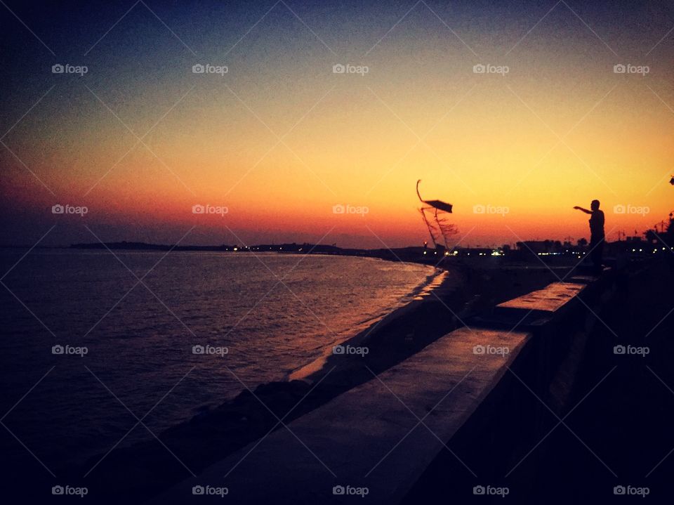 One of the most delightful summer days in the dawn during the sunrise, where the light from the sun blends with the pages of calm water and intersperses the waves in a beautiful plastic painting