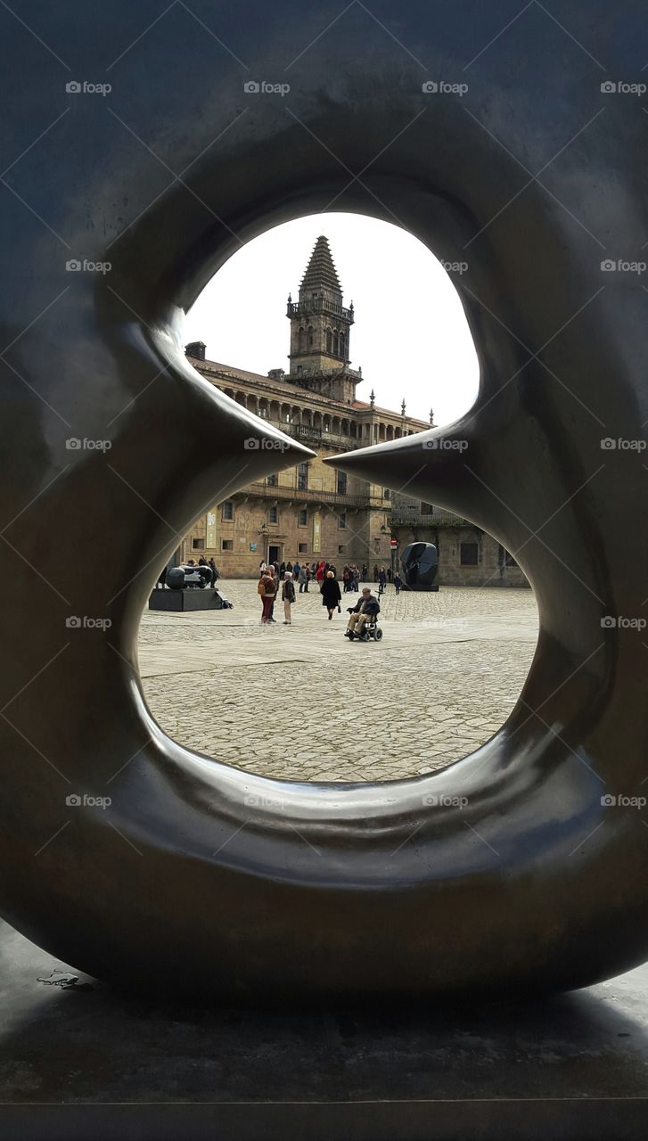 View of Obradoiro Square through a modern sculpture, Santiago de Compostela, Spain.