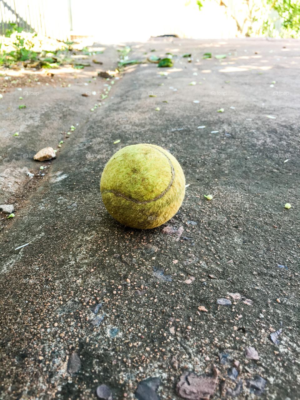 Dirty old tennis ball grunge lost and found one