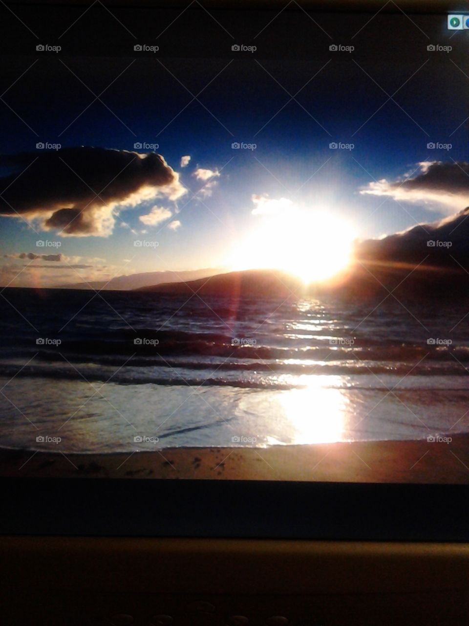 Spotlight. I was in Maui on vacation on the beach by myself enjoying the Sun setting