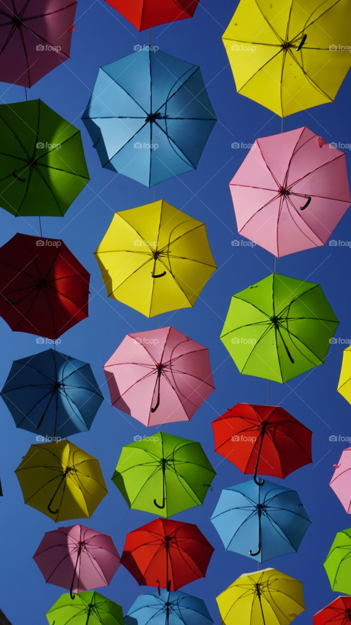 An array of umbrellas locking up