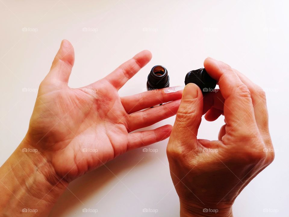 Woman hands put gel for warts