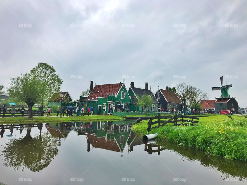 Water canal and wooden houses in the village Zaanse Schans, Holland 