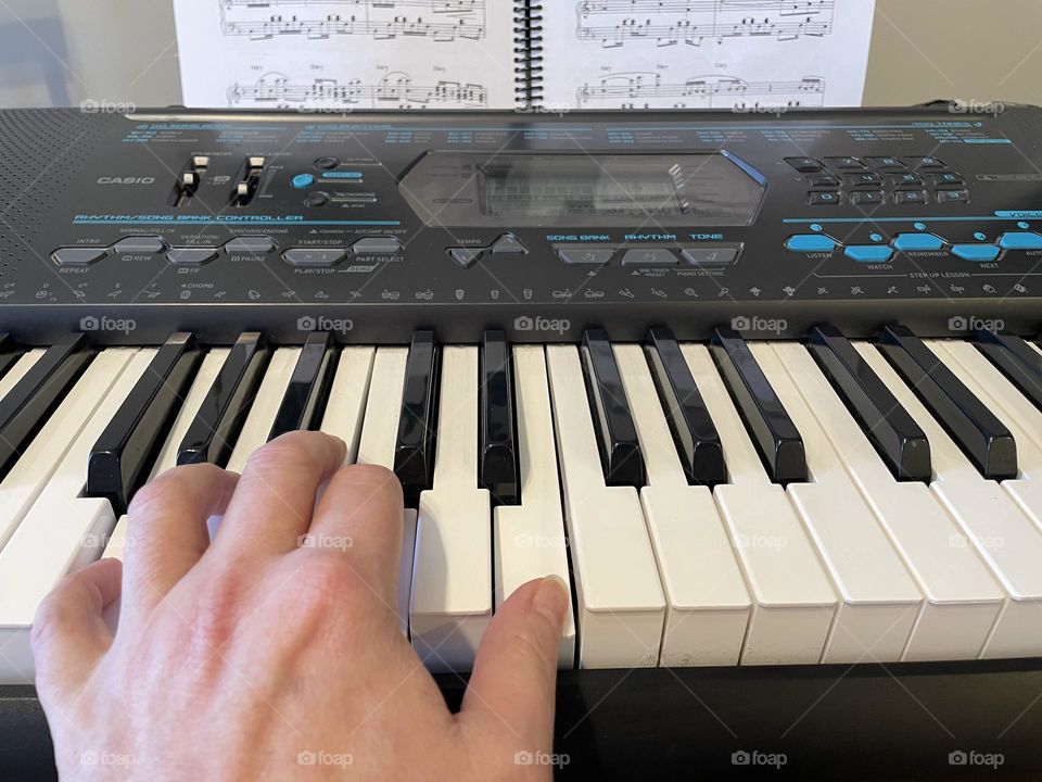 Some rectangles in this picture, taken with my iPhone 12, the keyboard keys, buttons, notes, music book in background 