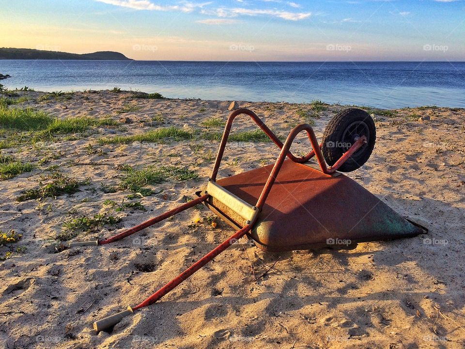 Wheel barrow on the beach