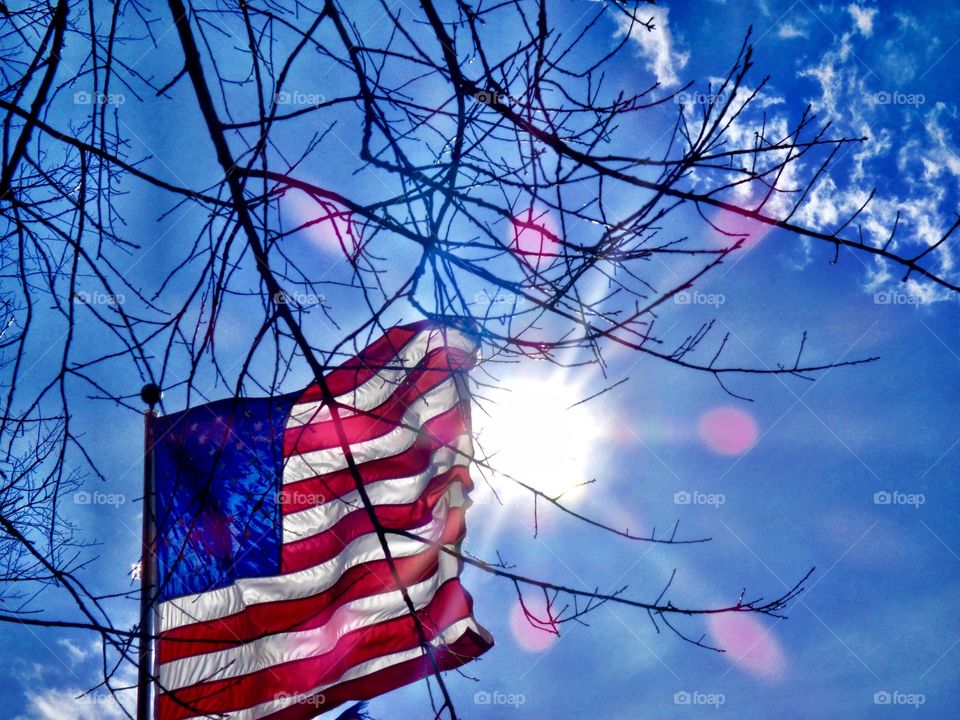 The American flag and the sun