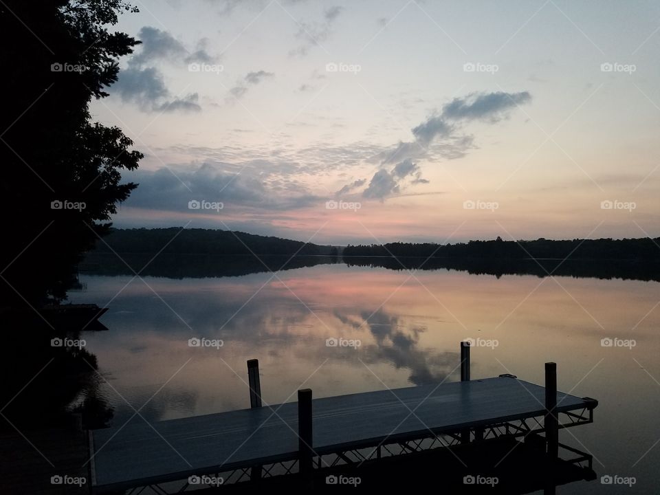 Scenic view of lake at sunrise