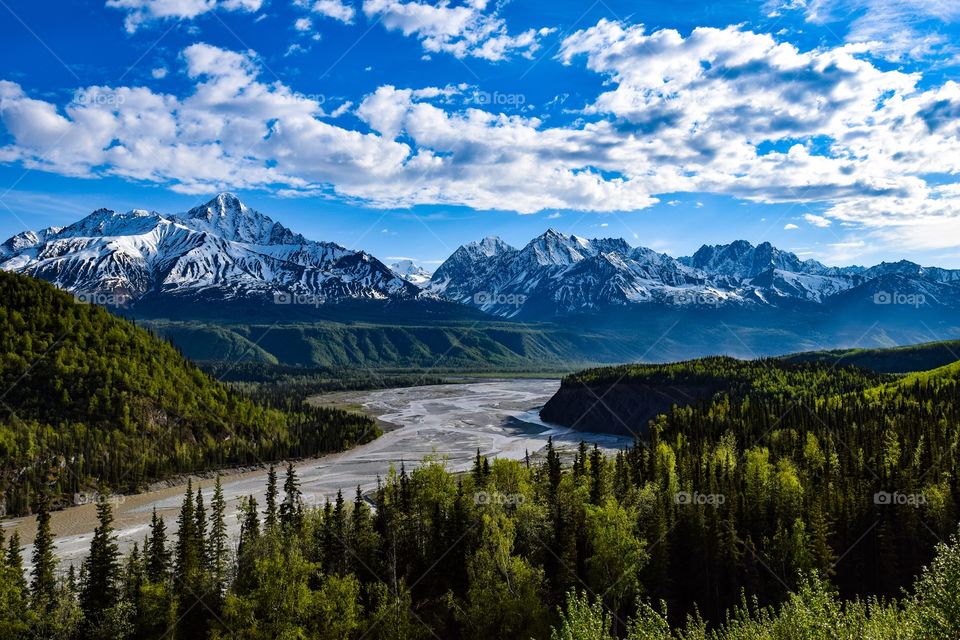 A beautiful view of the Matanuska River and the mountains along side about 20-30 miles outside of Palmer, Alaska