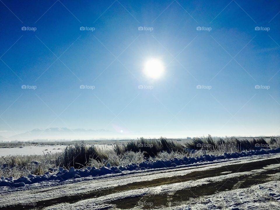 Freezing cold. Winter. Road. Ice. Snow. Beautiful. Blue sky.