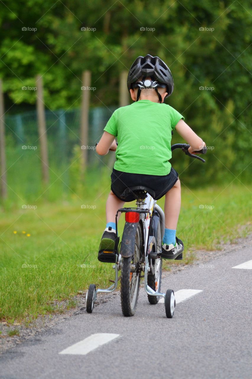 Boy bicycling