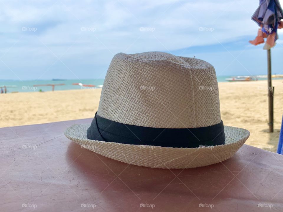 White hat at the beach