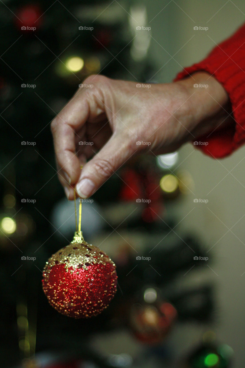 Holding a Christmas ball