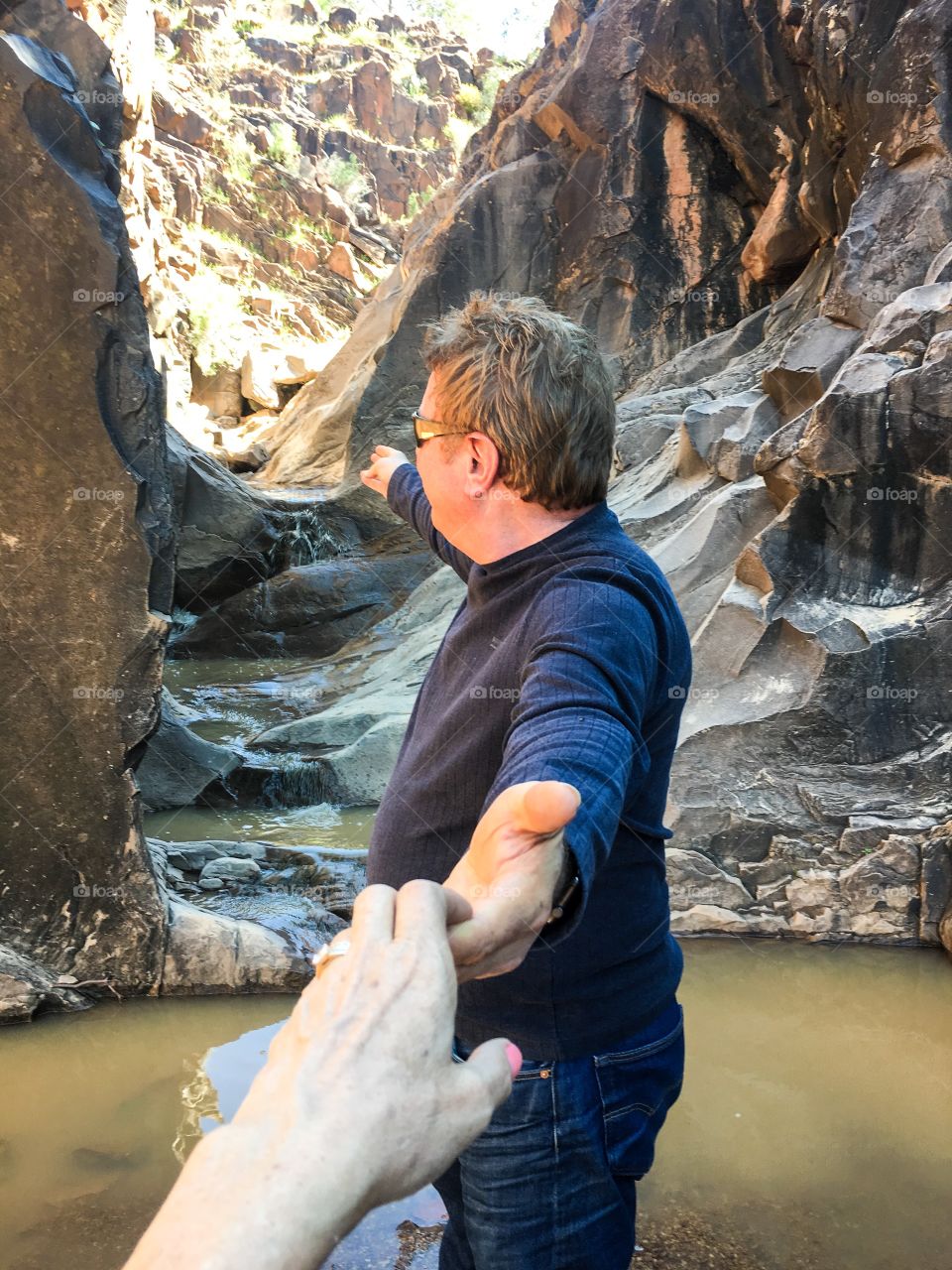 Afraid at first to venture into the gorge, a friendly brave soul offers his hand to guide me in. 