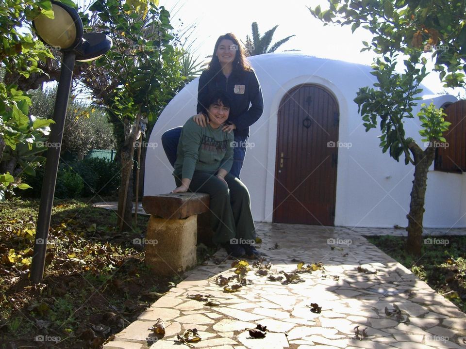 Grow up two Woman against igloo  house 