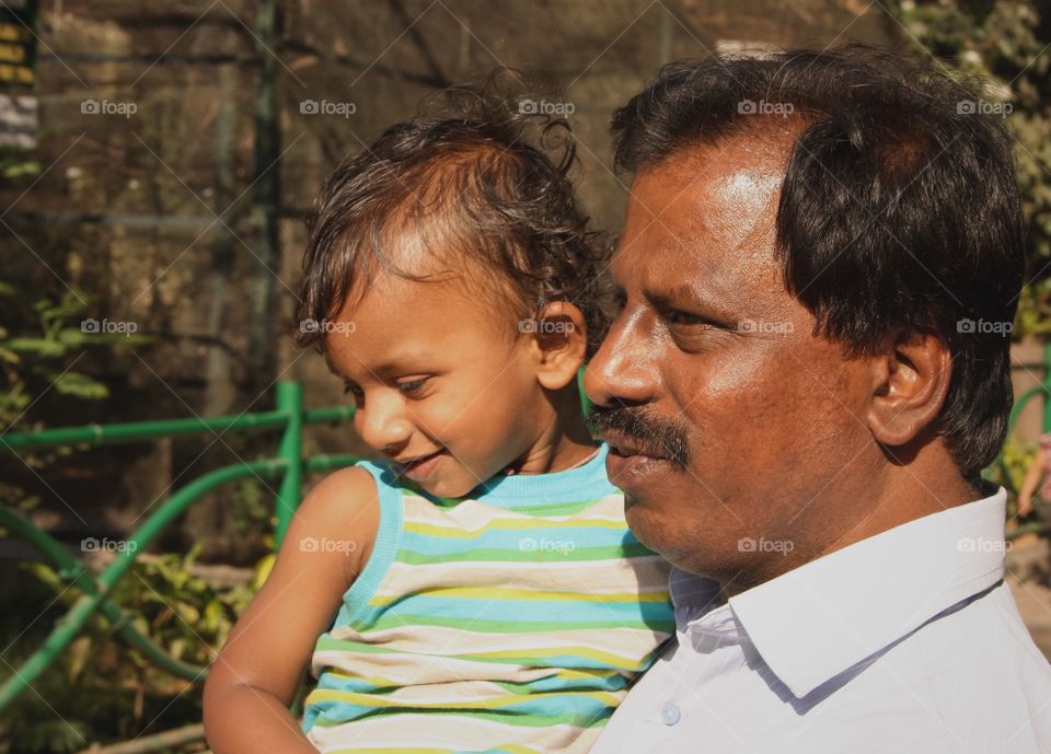 Happy father and son from India