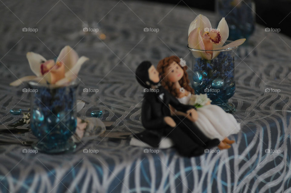 Dating couple in ceramics in unfocused background