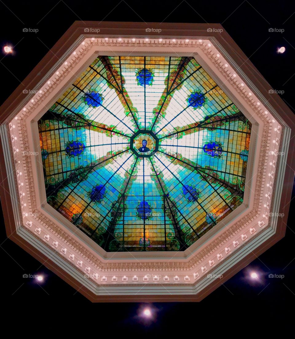 A colorful stained glass skylight in a Church sanctuary. 