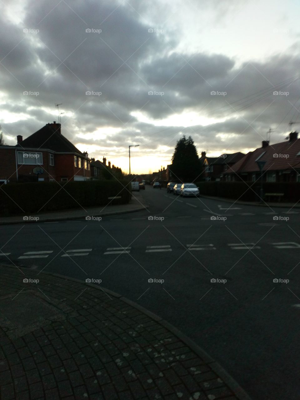 sunset road being cloudy