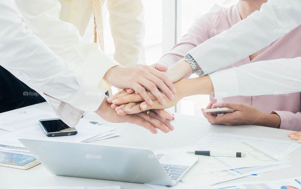 Business teamwork hand together for dealing