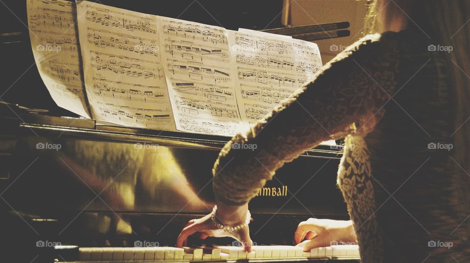 Woman playing piano on the stage