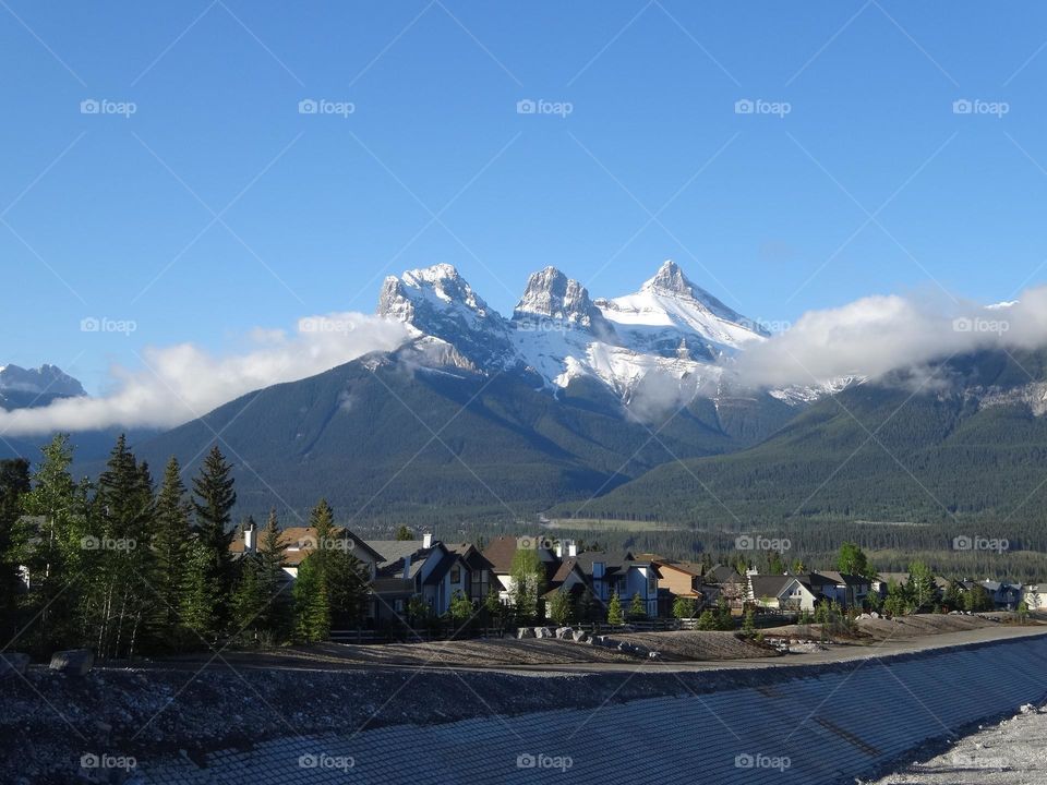 Rocky Mountain Delight: Scenic Street view of Mountain Town with Blue Skies 