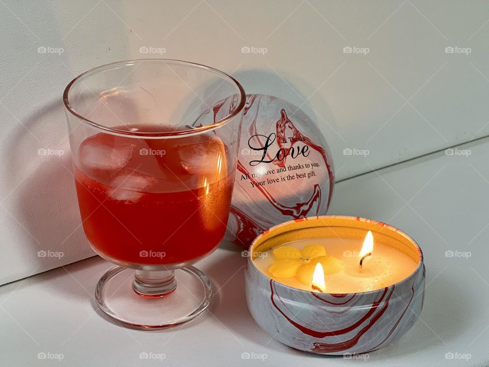 Candle and glass with cocktail 