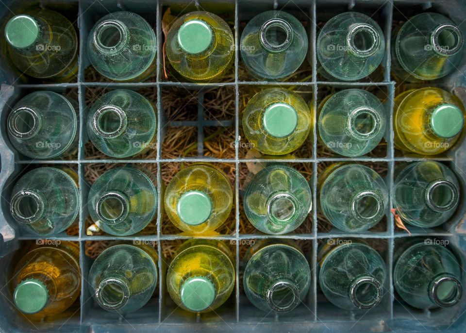 Crate of bottles, view from above, geometric shapes