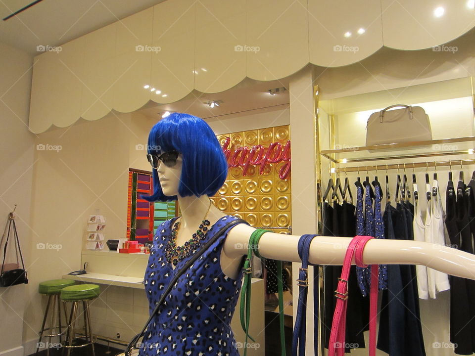 Store Display. Mannequin with Bright Blue Hair and Colorful Accessories. Happy. Designer Fashion.