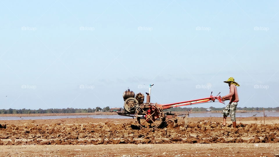 Cambodia farmer wild tilling machine