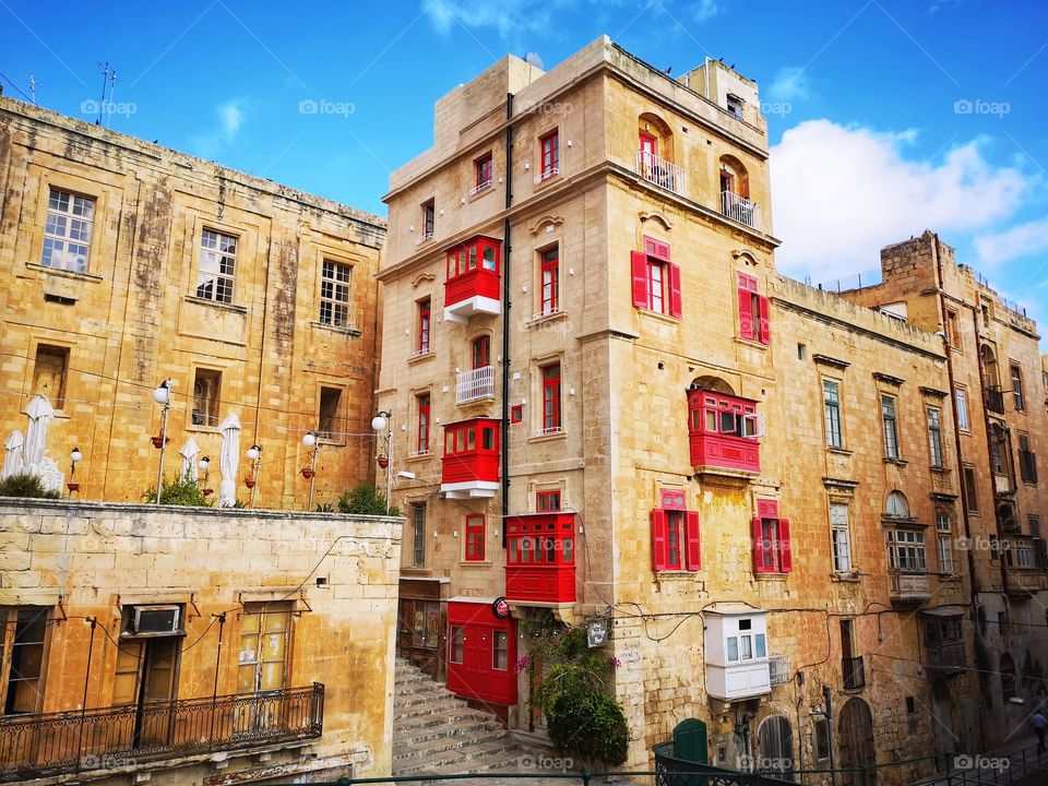 red wooden balconies of typical Maltese houses (Valletta)