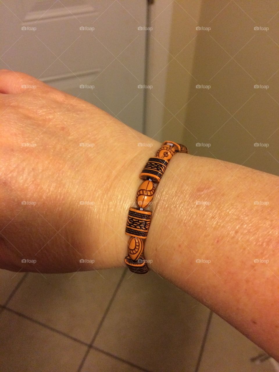 My homemade bracelet with brown beads.
