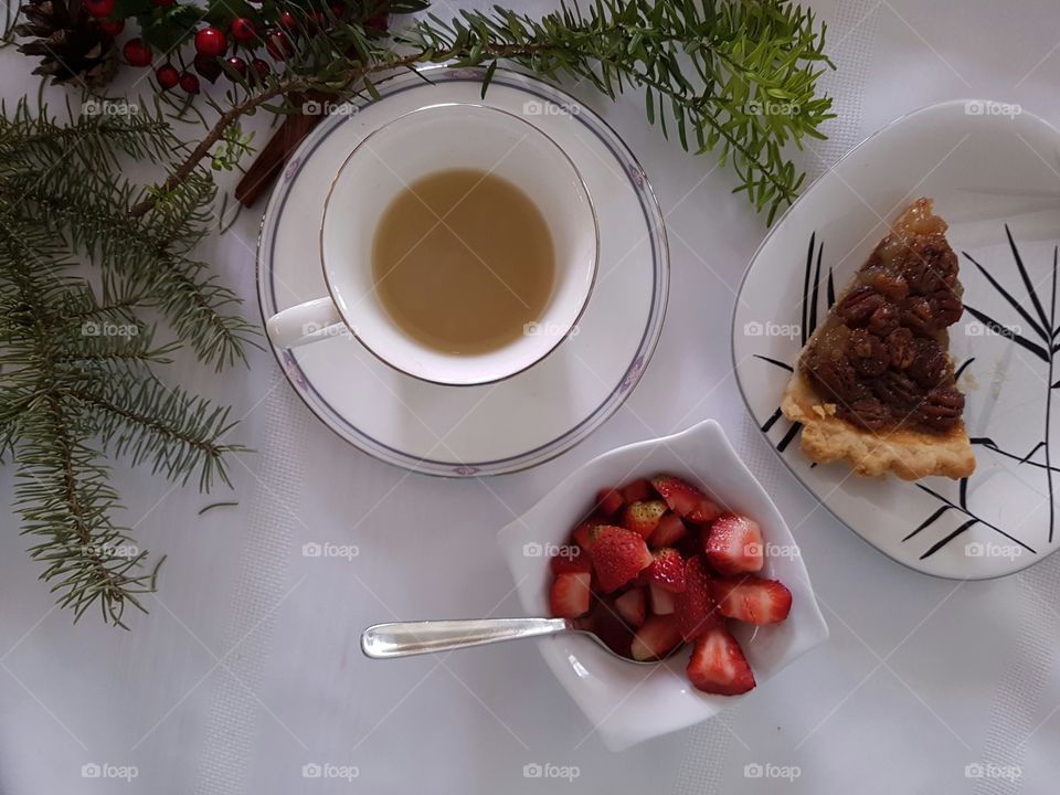 Pecan pie, fresh strawberries and coffee with rustic decor