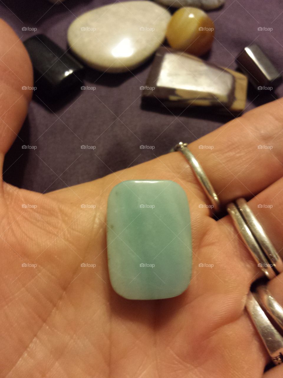 Turquoise stone in hand
