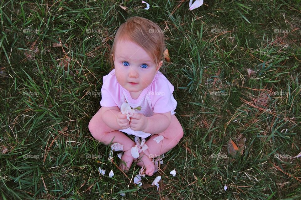 Baby with petals 