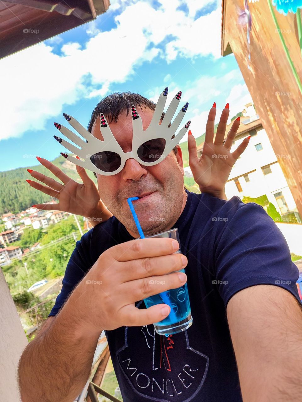 Energetic, Light-Hearted Funny Selfie with Cocktail and Sunglasses