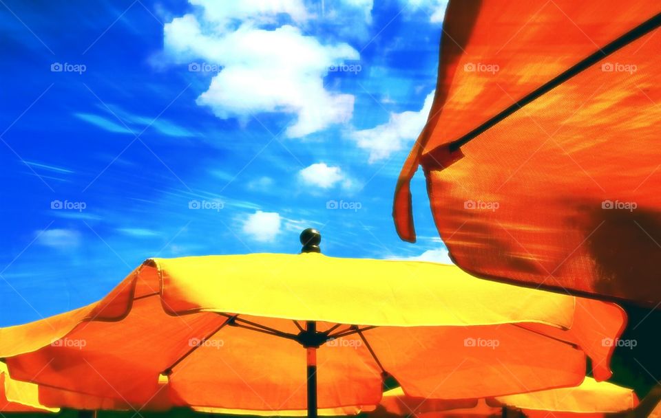 yellow umbrella and blue sky