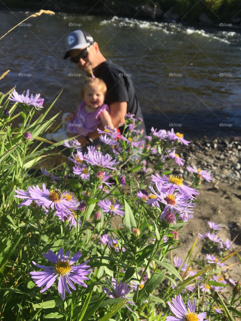 Daddy and daughter by the river