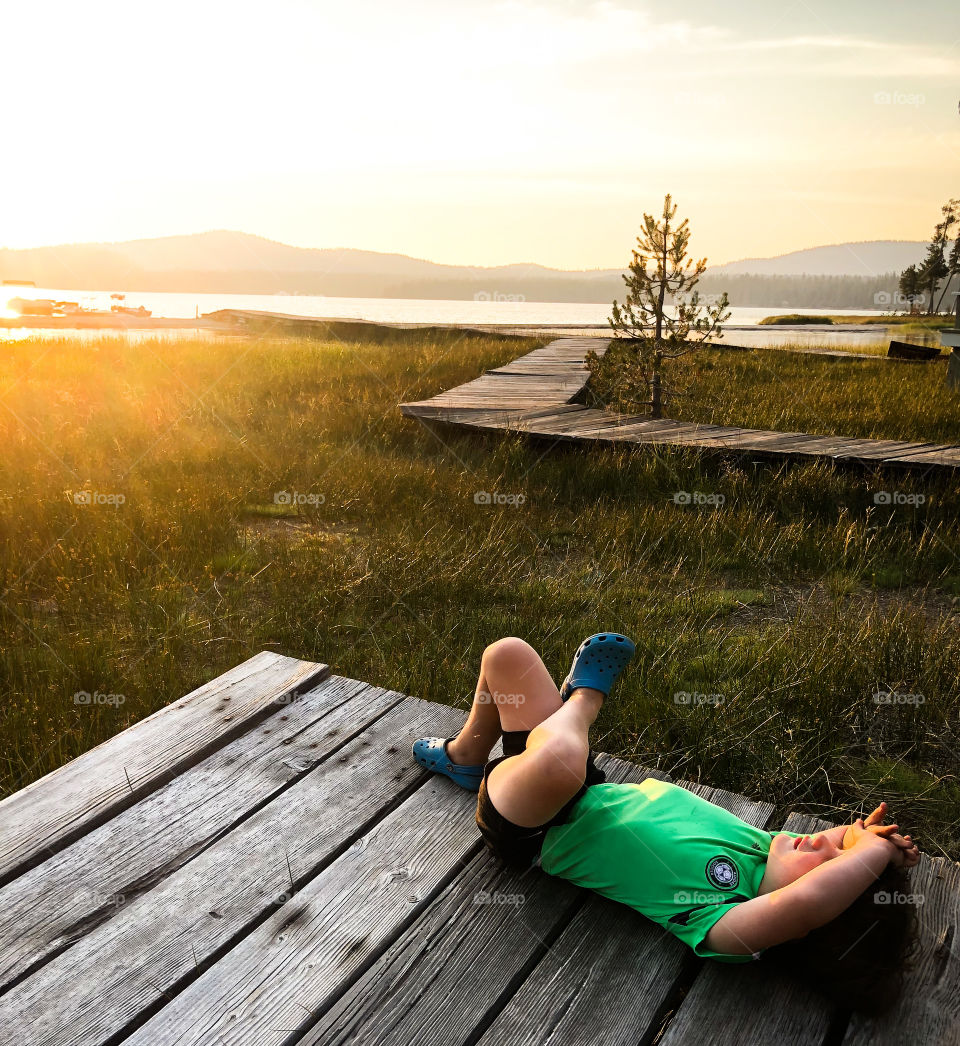 Basking in the evening sunlight next to the lake. Soaking in the moment and living the dream. 