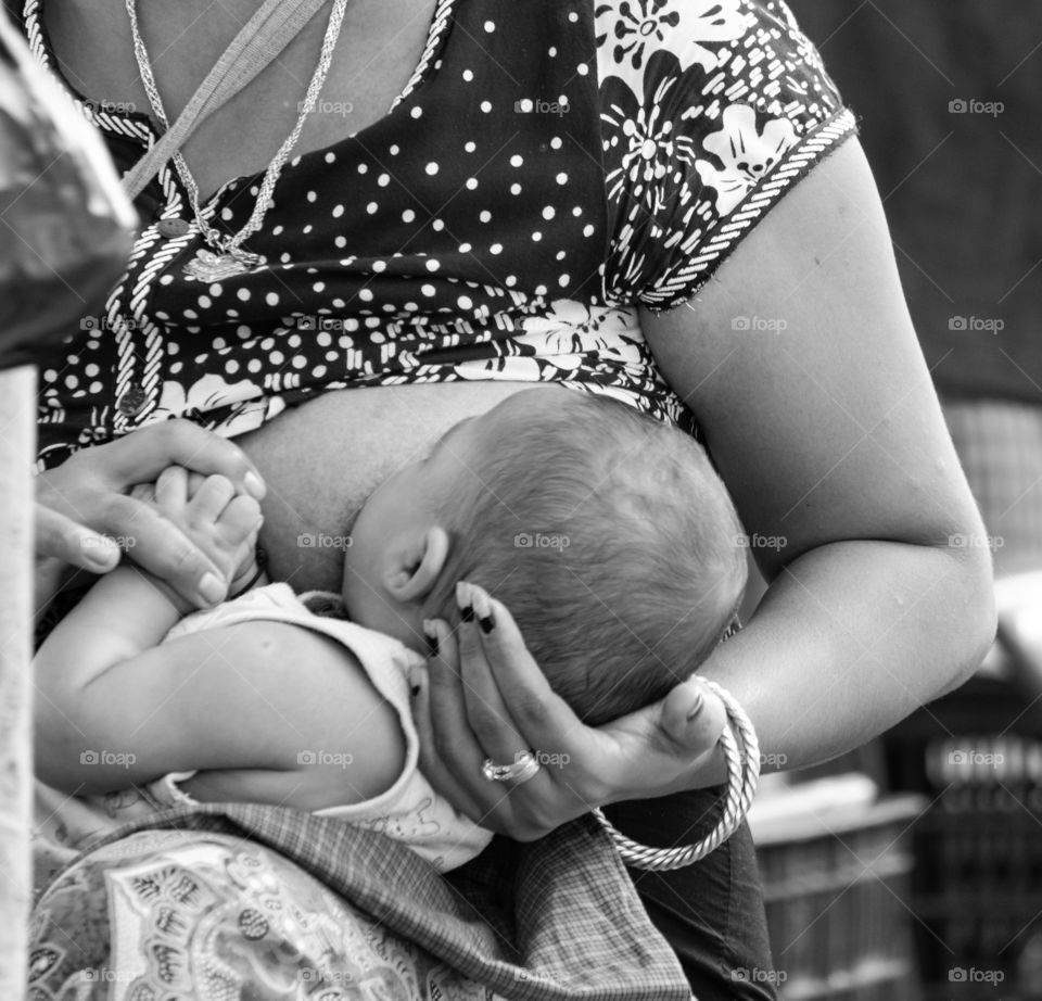 Local life photo of Woman is Breastfeeding her baby