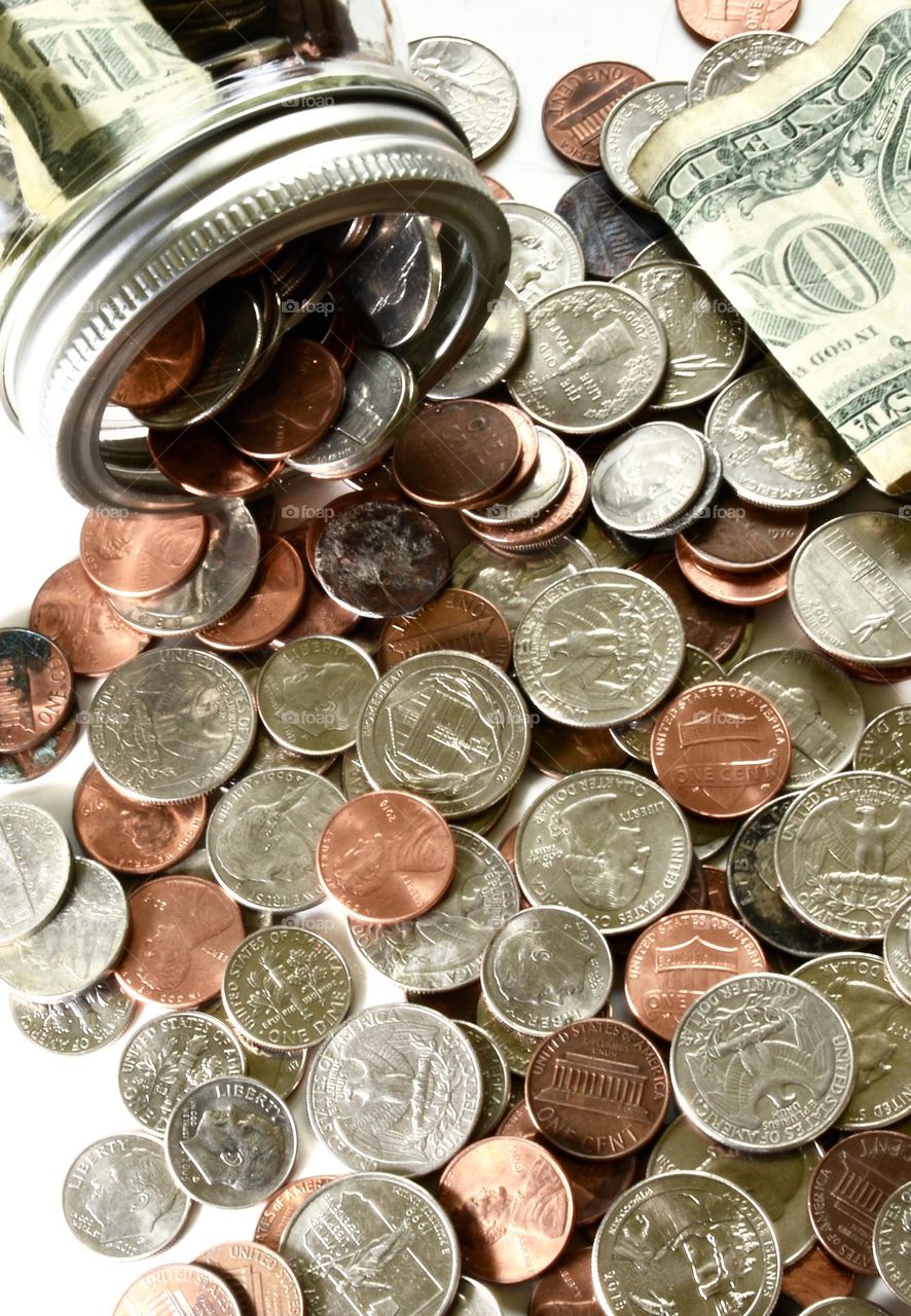 Geometry coins spilling out of a jar