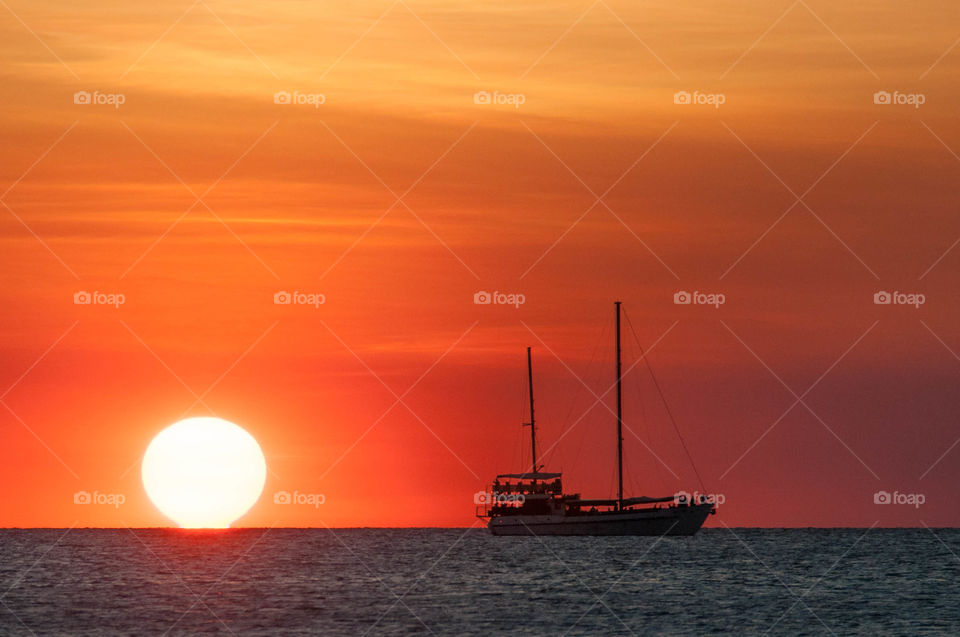 Sailboat at sunset in Darwin, Australia