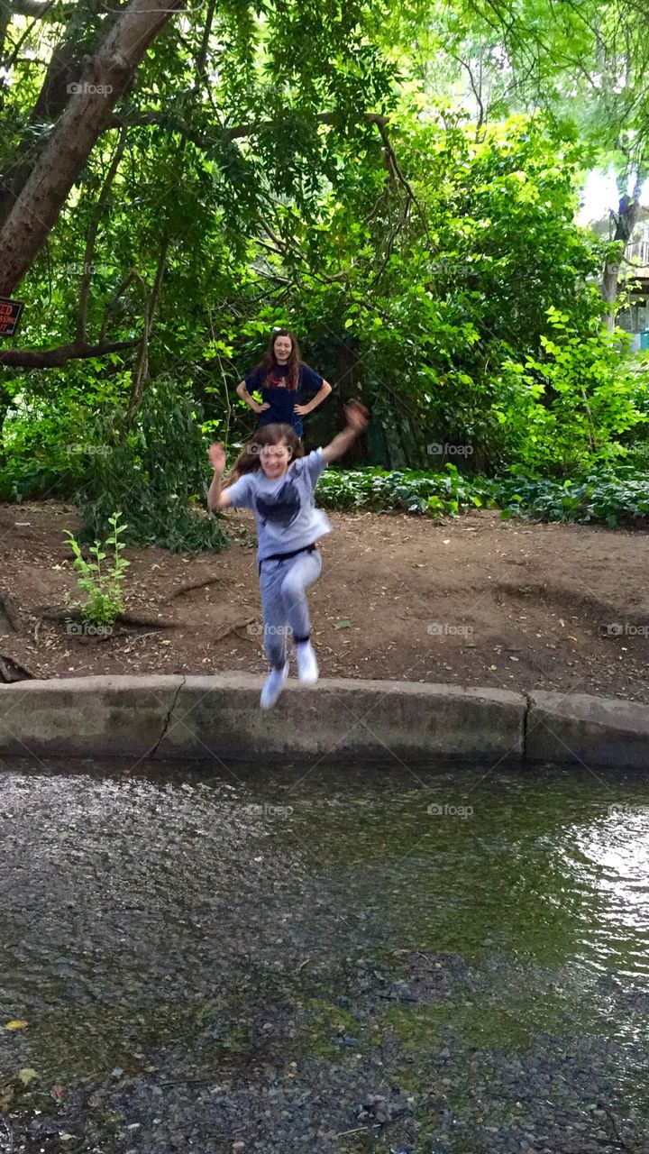 Child Jumping in the water