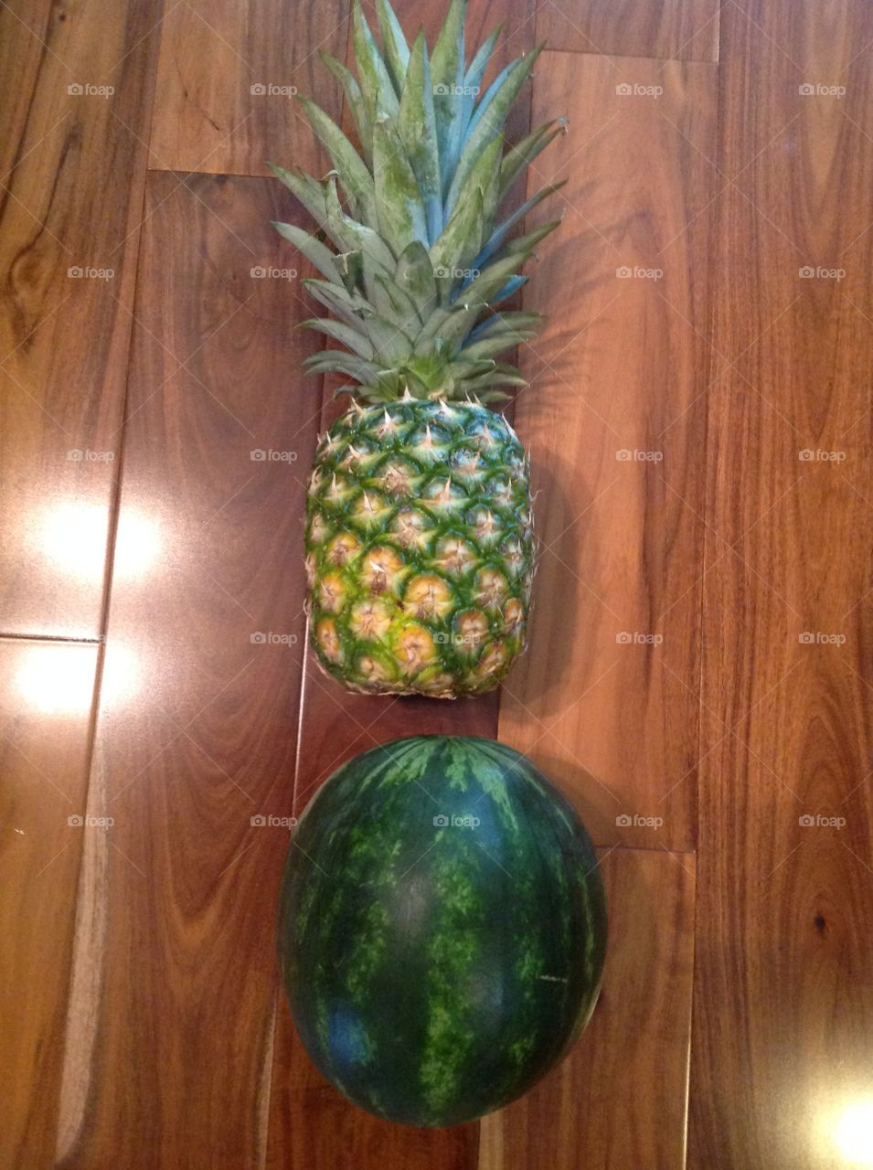 A pineapple and a watermelon.