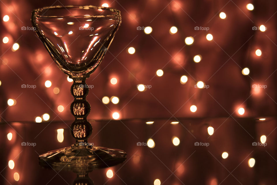 Empty glass on table with light