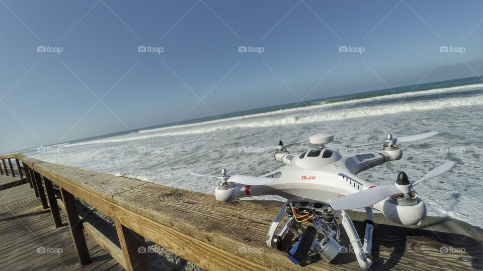 Drones, beach,  waves, photography and video.