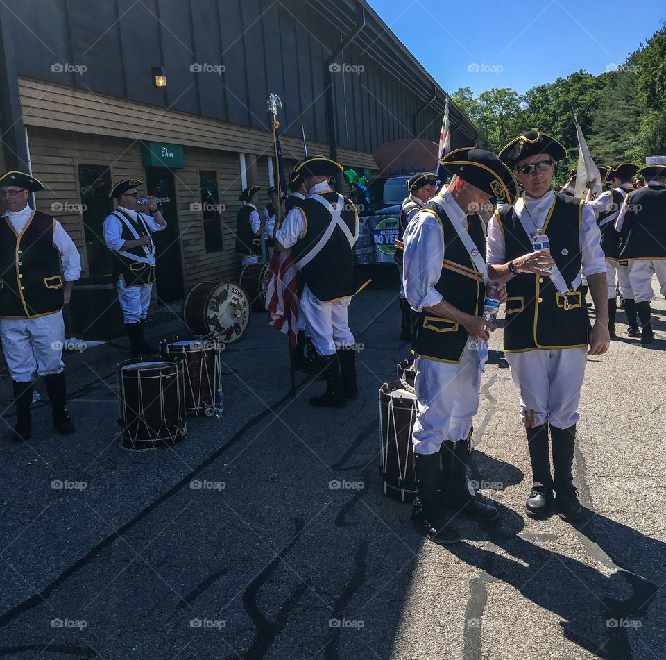 Band warming up and getting ready for the start of the parade they will be playing and marching in. 