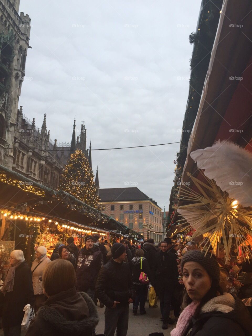 A Christmas market in the centre of Munich, Germany on a cold winter’s day, however it’s a warm environment with the amount of people present.